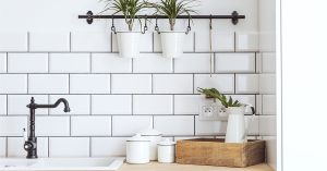 White subway tile with gray grout in a kitchen.