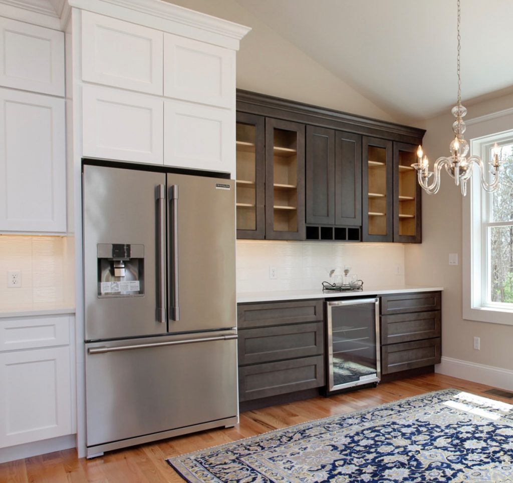 Large open kitchen with two toned cabinets.