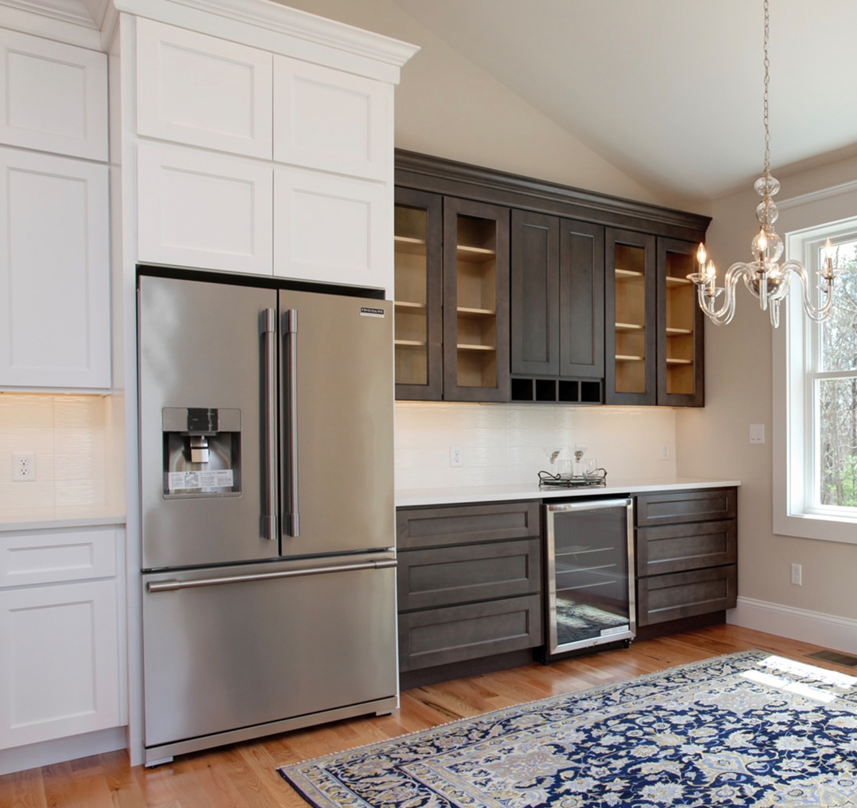 Large open kitchen with two toned cabinets.