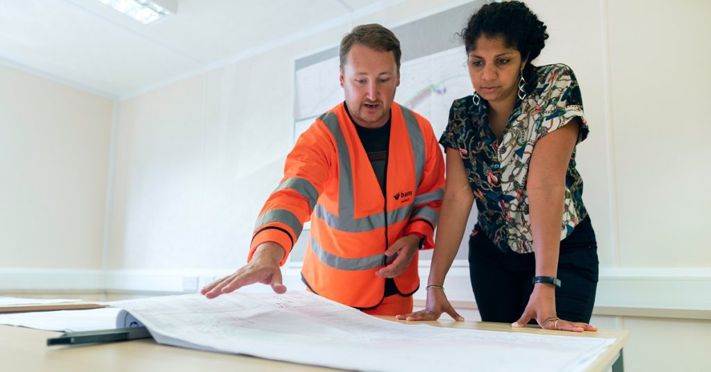 A contractor and homeowner discuss remodel plans.
