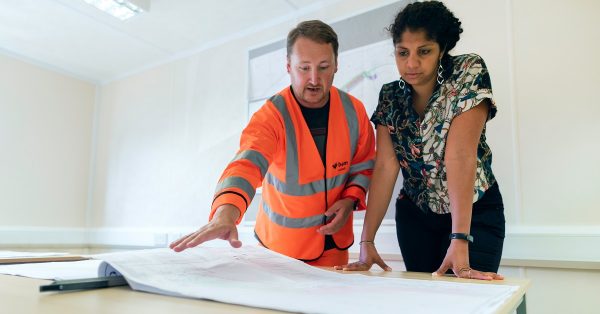 A contractor and homeowner discuss remodel plans.