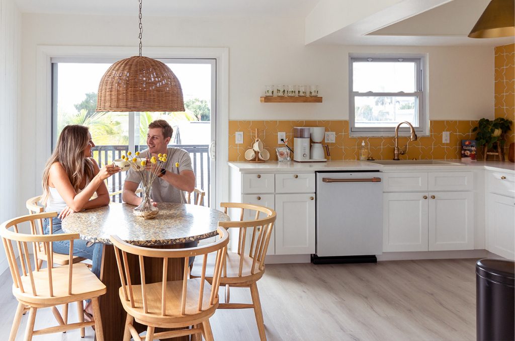 A couple sit in Joie Inn's Sun Room kitchen.