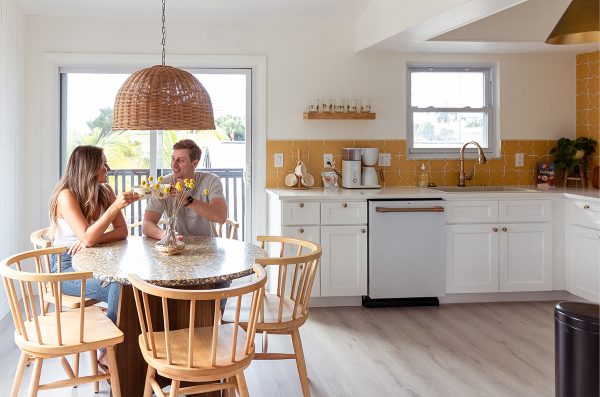 A couple sit in Joie Inn's Sun Room kitchen.