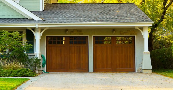 Front of a house with a double garage door.