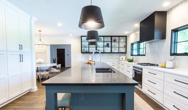 A kitchen island flanked by Florence White shaker cabinets from the RTA Cabinet Store.