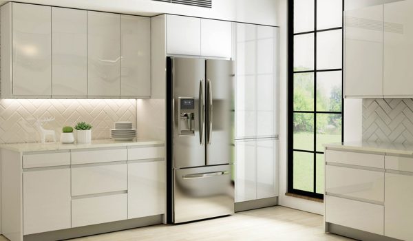 White kitchen with flat front cabinets and no handles.