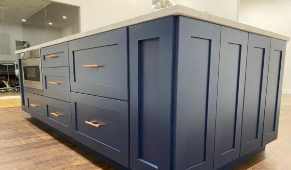 Blue kitchen cabinets on a kitchen island.