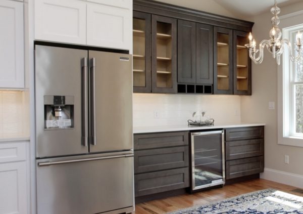 View into pantry area with additional cabinets and countertop.