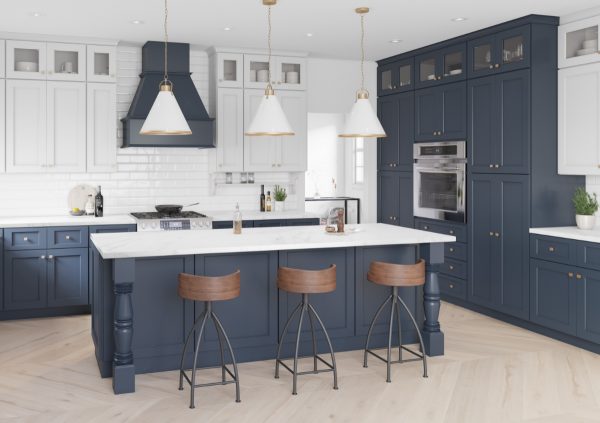 Blue cabinets in a large neutral kitchen with wood floors.