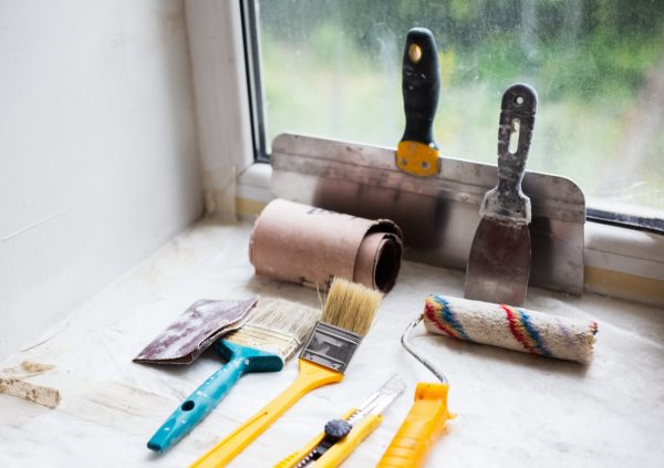 Assortment of paint brushes and other tools.