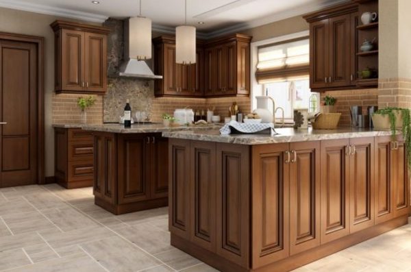 Traditional kitchen with dark wood cabinets and beige tile.