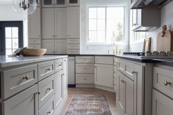 Large kitchen island in the center of the kitchen with large drawers.