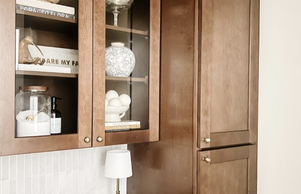 Close up of storage cabinets in a renovated laundry room.