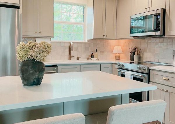 Cozy kitchen with neutral cabinets.